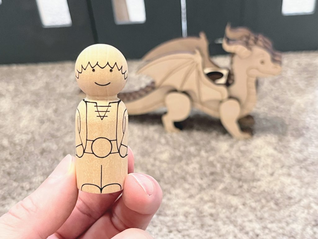 Dragon and rider peg doll set showcasing the rider peg doll