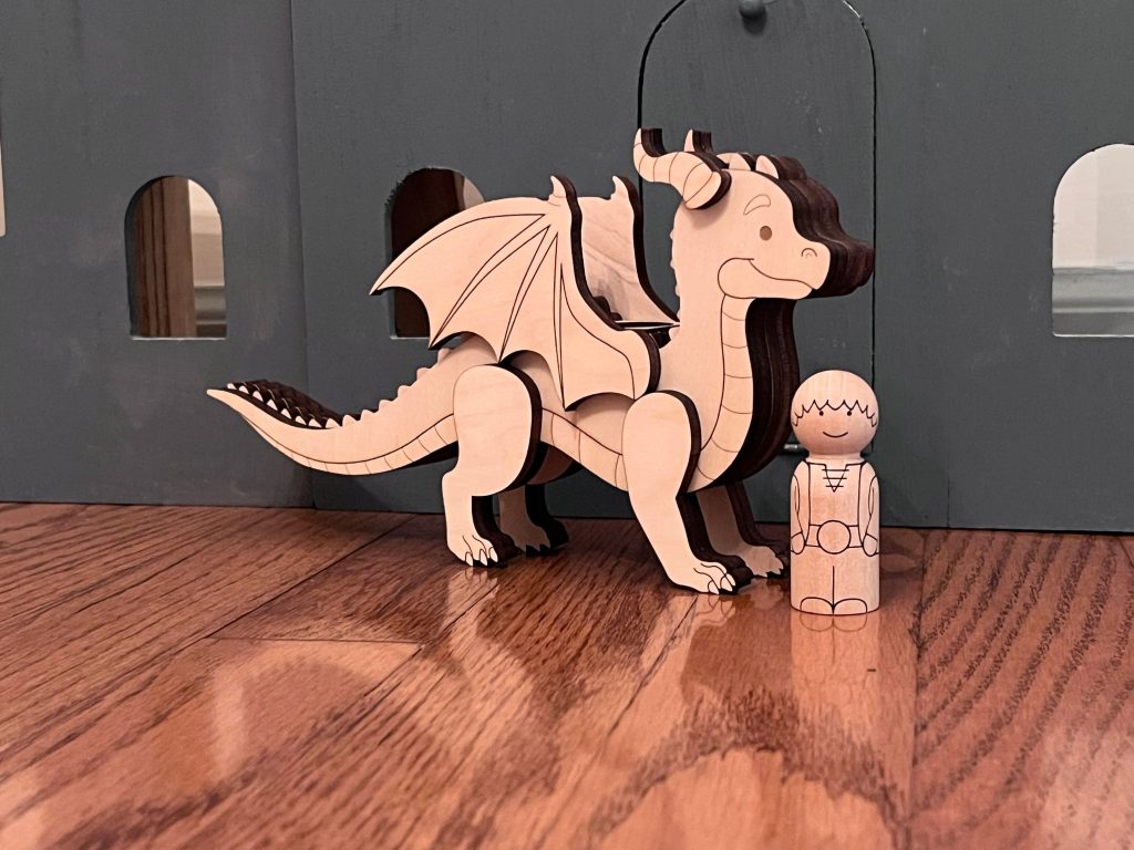 Dragon and rider peg doll set with dragon and rider standing next to each other