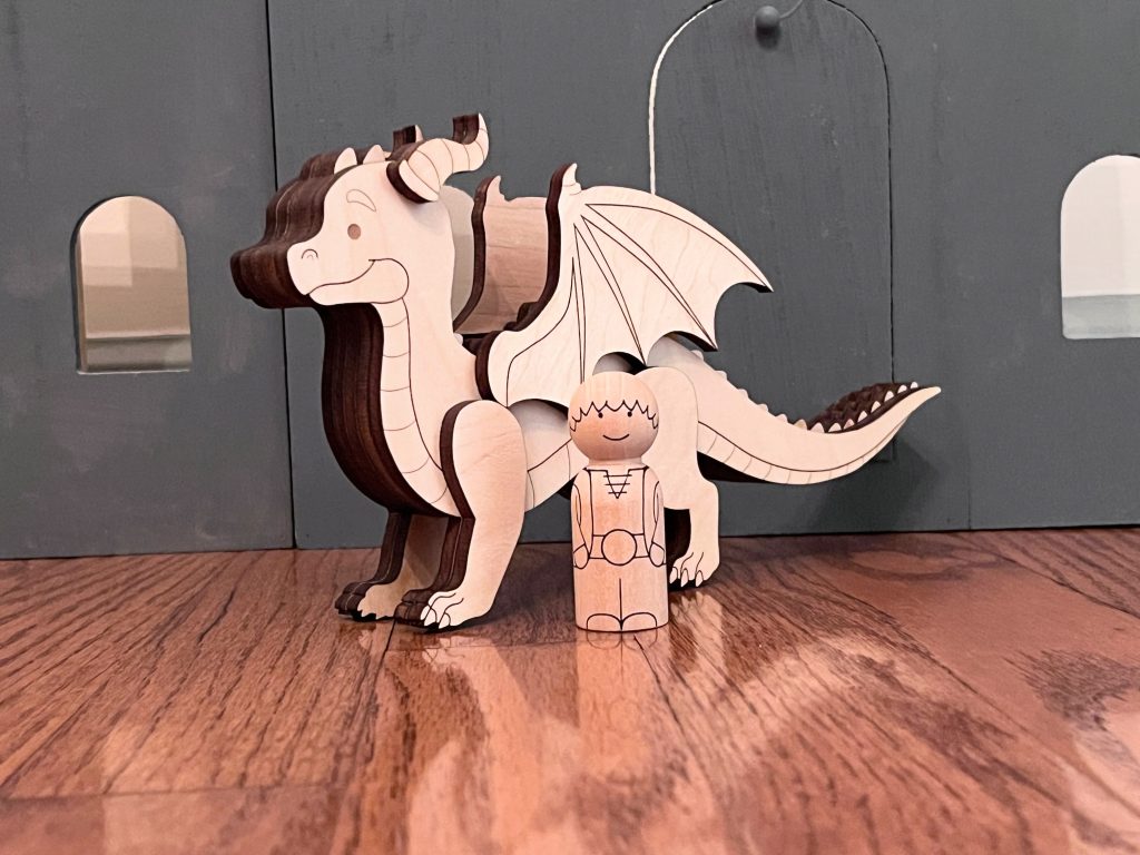 Dragon and rider peg doll set with dragon and rider standing next to each other