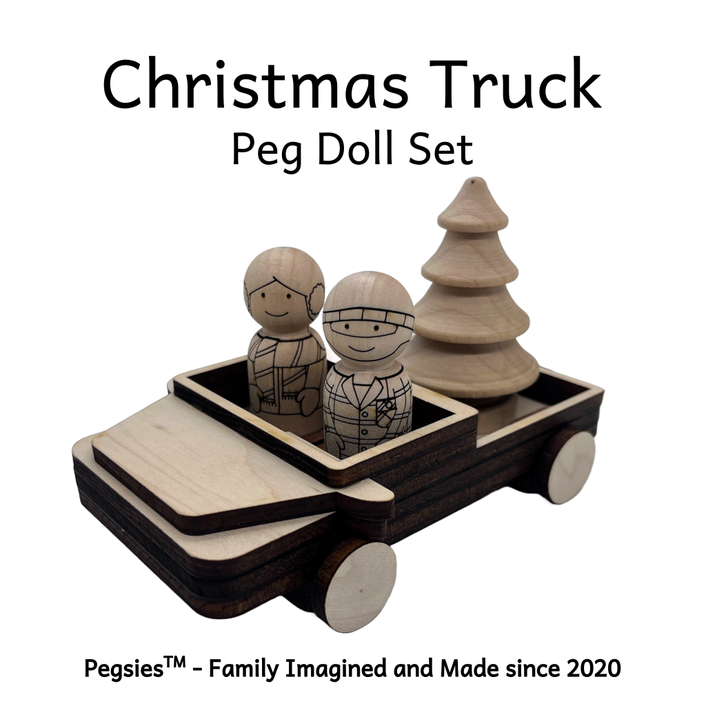 Boy and girl peg doll characters riding in a wooden pickup truck with wooden christmas tree in the truck bed.